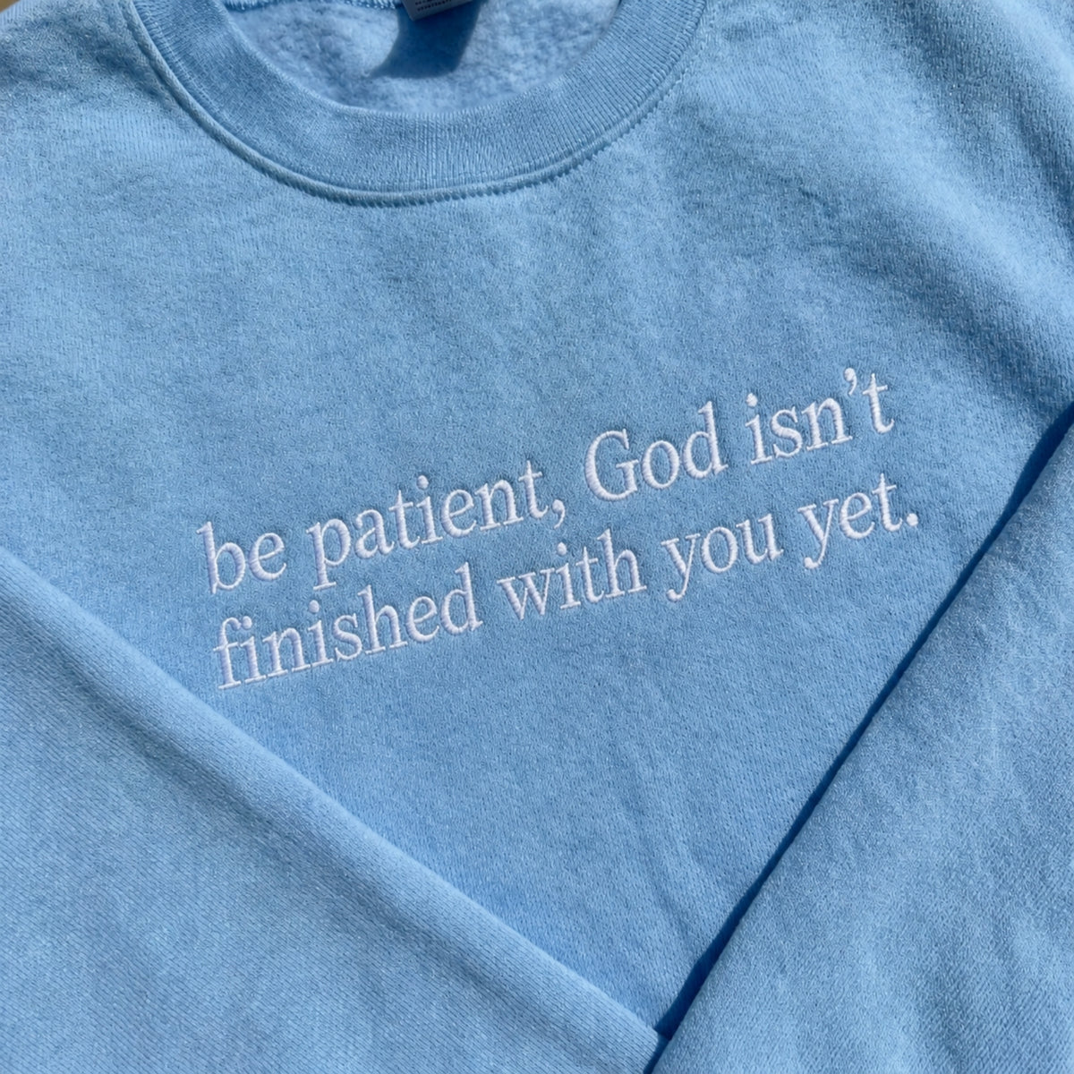 Be Patient God Isn't Finished With You Embroidered Sweatshirt