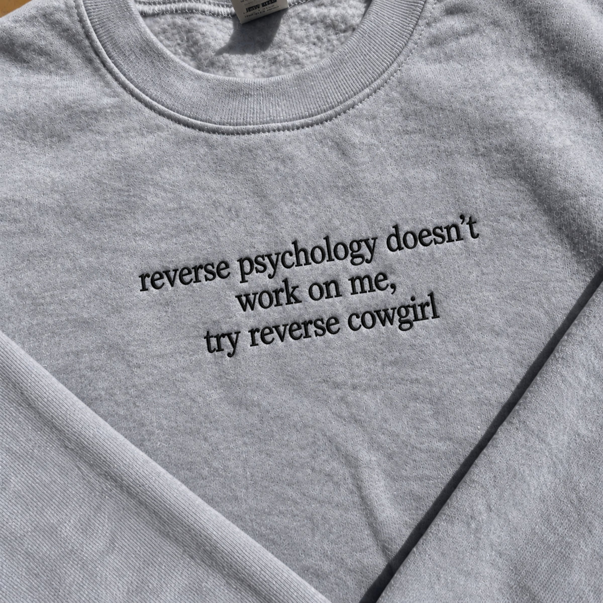 Reverse Psychology Doesn't Work On Me Embroidered Sweatshirt