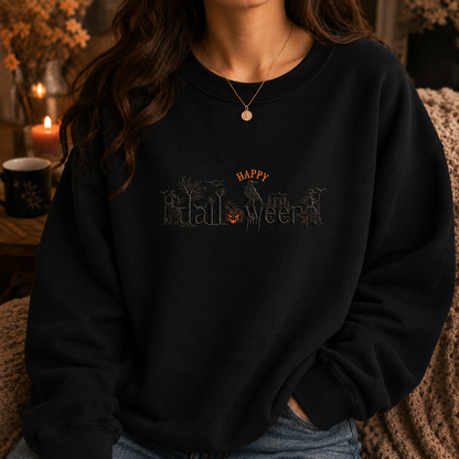 A woman wearing a black crewneck sweatshirt with a distressed 'HAPPY Halloween' graphic across the chest, styled in a cozy, warmly lit indoor setting.
